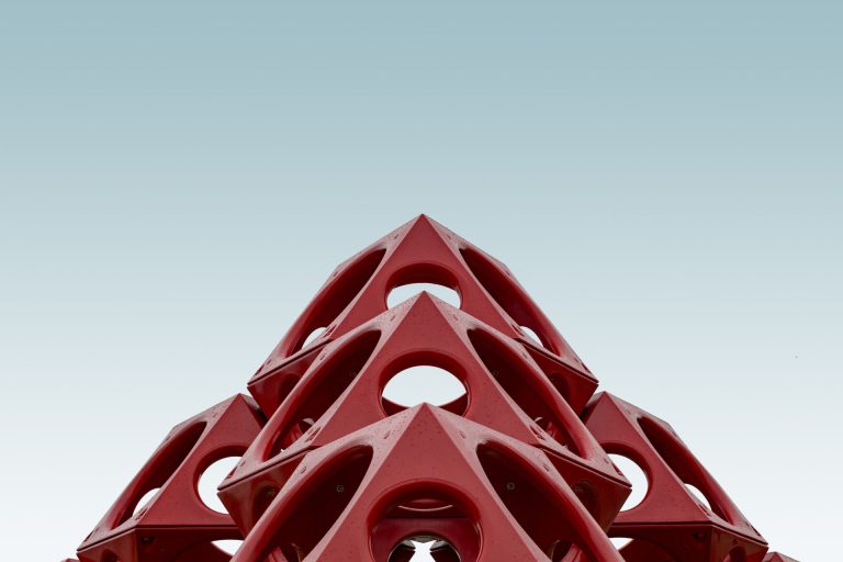 Low angle red geometrical structure blue sky